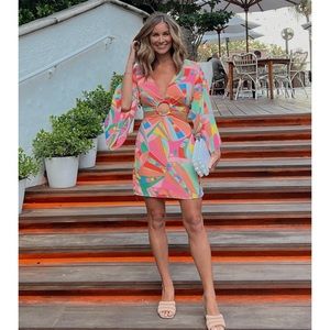 Mini multi color dress with cut out from and back.